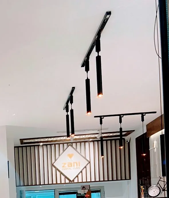 The Zani diamond logo above reception, with pendant lights